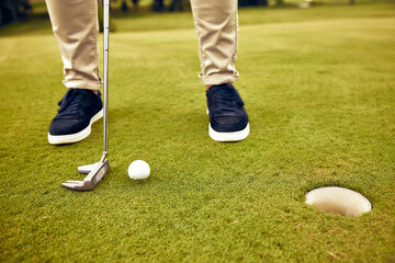 A CloseUp View of a Golfer Engaged in Preparing to Putt on a WellMaintained Green