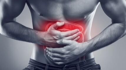 Man experiencing abdominal pain, holding stomach in discomfort.