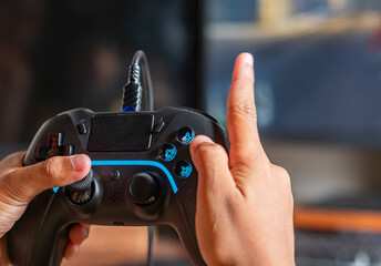 Hands Holding Gaming Controller