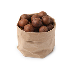 Macadamia nuts in paper bag isolated on white