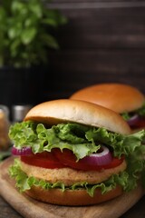 Delicious vegetarian burgers with chickpea cutlets on table, closeup
