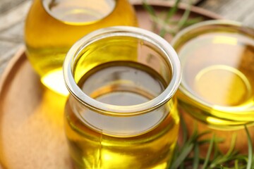 Cooking oil in jar on table, closeup