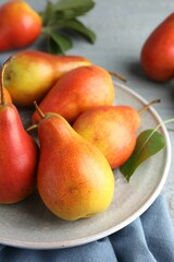 Many ripe juicy pears on table, closeup