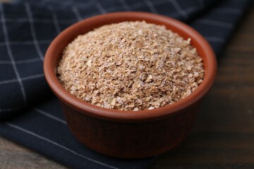 Buckwheat bran in bowl on table, closeup