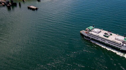 Seattle Ferry in the puget sound. Aerial view of ferry entering dock.