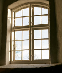 Fototapeta premium Windows, house and building with view, structure and empty with architecture, hospitality and woodwork. Frame, natural light and day with sunshine, historic space and apartment with paint and hotel