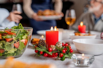 Christmas table decorated with candles and christmas decorative things