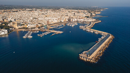 Mola di Bari, Italy - 23 August 2024: Areal view of the beautiful harbor with fishing boats