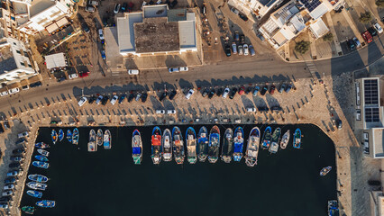 Mola di Bari, Italy - 23 August 2024: Areal view of the beautiful harbor with fishing boats