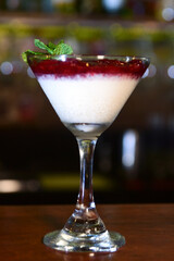 bowl with sweet dessert condensed milk with strawberry syrup tasty high-calorie food