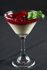 bowl with sweet dessert condensed milk with strawberry syrup tasty high-calorie food