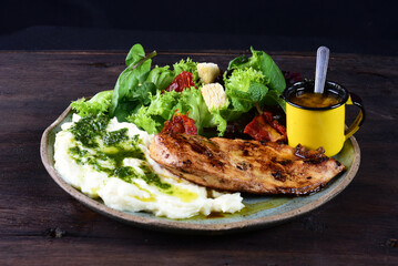 plate with fish fillet and chicken salad and mashed potatoes healthy food tasty light lunch