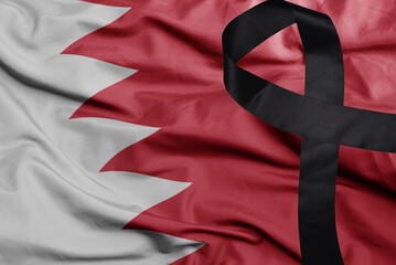 waving national flag of bahrain with black mourning ribbon .tragedy concept