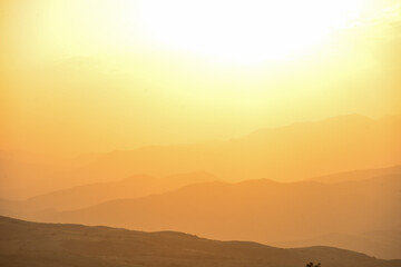 Beautiful sunset over the mountains in the summer.