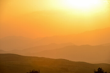 Beautiful sunset over the mountains in the summer.