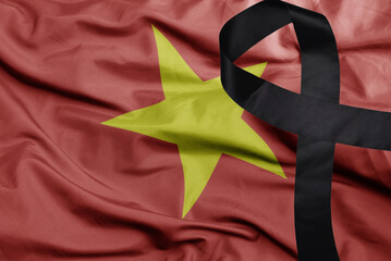 waving national flag of vietnam with black mourning ribbon .tragedy concept