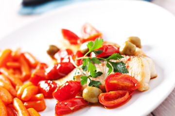 Fillet of halibut with tomatoes and olives