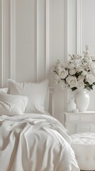 a modern room where all the elements are the same white color in: white walls, a white minimalist bed with white cotton sateen bed linen, white posters on the walls, white classic ottoman near the bed
