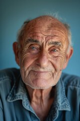 Obraz premium Portrait of Contentment and Wisdom on Pastel Blue Monochrome Background for Print or Poster