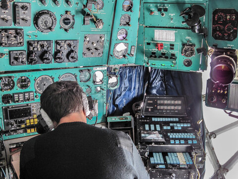 The Ilyushin Il-76 flight navigator, working in the lower deck canopy section, on the flight from Punta Arenas, Chile to Patriot Hills, Antarctica. A runway at Union Glacier replaced Patriot Hills.