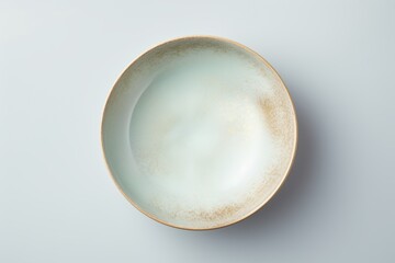 Fototapeta premium Elegant minimalist ceramic tableware close up of grey, blue, and white plate or bowl design