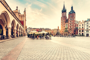 Naklejka premium Cracow, Poland old town and St. Mary's Basilica seen from Cloth hall at sunrise