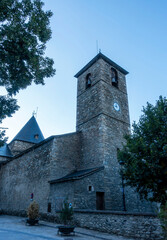 Bell tower of the church of Santa Maria la Mayor in Benasque. Huesca, Aragon, Spain.