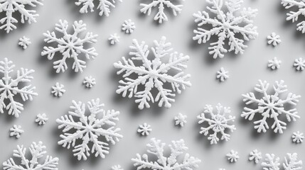 White snowflakes forming christmas decoration on grey background