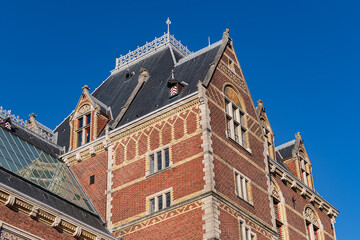 Fototapeta premium Side of the Rijksmuseum building (1885), seen from the Ruysdaelkade. Amsterdam Rijksmuseum holds many masterpiece paintings of Dutch and world art. Amsterdam, the Netherlands.