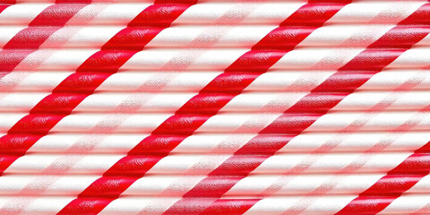 Obraz premium A textured background featuring diagonal red and white stripes, creating a dynamic visual effect. The contrast between the vibrant colors adds energy and can serve as an eye-catching backdrop for vari