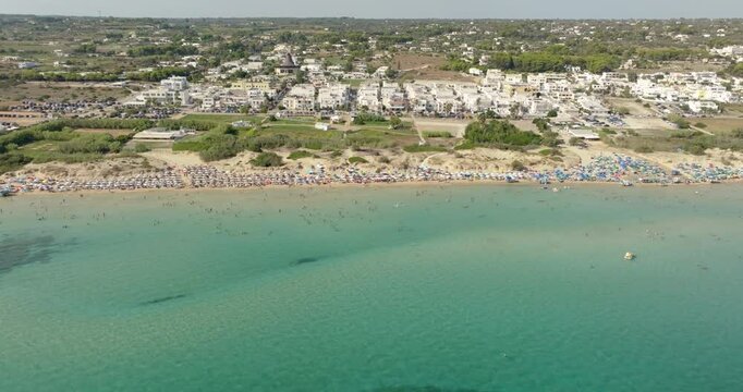 Aerial view of Pescoluse beach in Salento, Puglia, Italy. It is a hamlet of Salve and a seaside village with many holiday homes and villas. This beach is also called the Maldives of Salento.