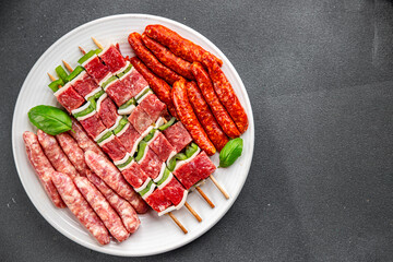 sausage meat assorted juicy pork, beef fresh delicious gourmet food background on the table rustick food top view copy space