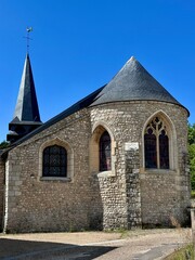 Fototapeta premium view of a small church of a small village in the French countryside on a summer day 