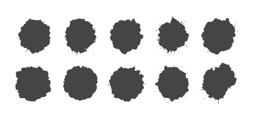 Black ink blots on a white background