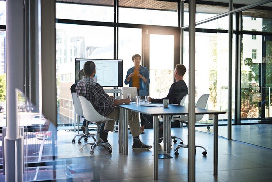 Woman, presentation and charts on screen, talking and group with feedback for b2b sales in office. Business people, speaker and info with pitch, review and board with stats for brand communication