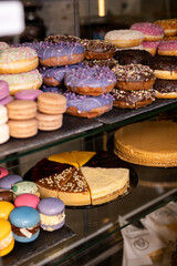 A tempting display of colorful pastries and desserts in a charming bakery revealing delightful treats for every sweet tooth