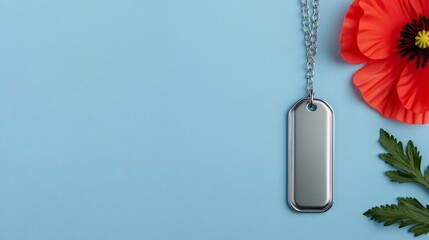 Isolated set of dog tags draped over a red poppy, on a soft gradient blue background, with ample space for Veterans Day text 