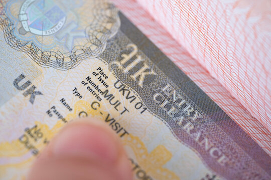 British tourist visa in passport, United Kingdom travel multivisa close-up, travel permit, pass border control, international voyage, UK entry