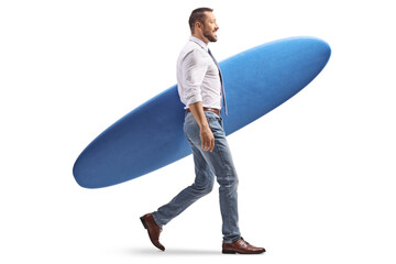 Businessman walking and carrying a surfboard