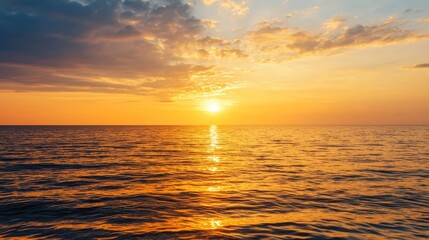 Fototapeta premium A serene sunset over the ocean, with vibrant colors reflecting on the water's surface, creating a peaceful atmosphere.