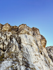 close up of rocky mountain peak under clear blue sky. Log pod Mangartom. Slovenia. Julian alps. mountain landscape. nature photography