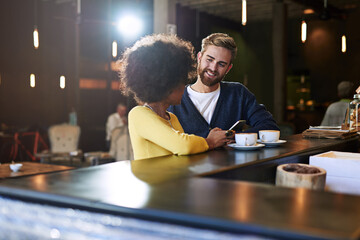 Happy, couple and relax with phone at cafe of ecommerce website, online menu and breakfast information. People, discussion and date with coffee for hospitality, social gathering and retail restaurant