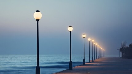 Obraz premium Street Lamps Along a Seaside Walkway at Dusk