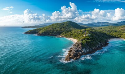 Fototapeta premium Aerial panorama of a lookout high on a rugged coastal headland above a calm turquoise ocean