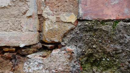 Textured Wall With Peeling Paint and Stone, Showcasing Weathered Beauty