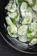 Сucumber salad fresh cream tasty food dish fresh delicious gourmet food background on the table rustic food top view copy space top view keto and paleo diet Vegetarian and vegan food