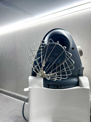 Mixer in the kitchen at home. Equipment for making cream. Professional mixer is on the table. Mixer whips cream. Pastry tools. Making a cake