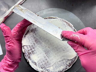 Pastry, baking and cooking concept - woman making cake in kitchen at home. Process of making custom cake without cake