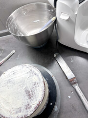 Pastry, baking and cooking concept - woman making cake in kitchen at home. Process of making custom cake without cake