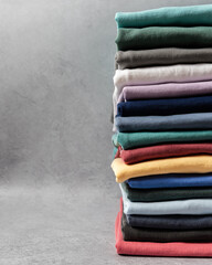 Folded Crewneck Sweatshirts in Various Colors Stacked on Seamless Background, Room for Copy, Casual Apparel Display, Product Photography for Fashion Branding, Clothing Mockup Template
